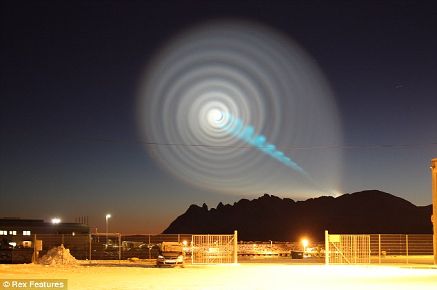 Strange spiral: Residents in northern Norway were left stunned after the lightshow, which almost looked computer-generated, appeared in the skies above them